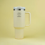 The H2.0 EVERY SIP IS AN ADVENTURE™ – Porcelain Crème 40 oz Hydration Tumbler – Elegance on the Go